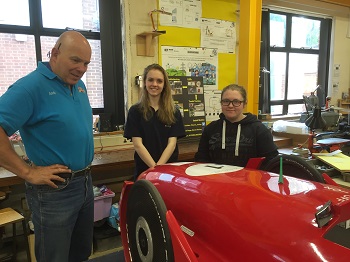 Emily and Ella discuss carbon fibre techniques with our visitor Andy 350 pixels