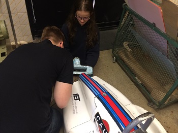 Luke and Charlotte working on the bodywork on the back of Dougal 350 pixels