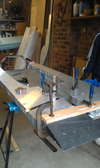 Wing glued and clamped to axles