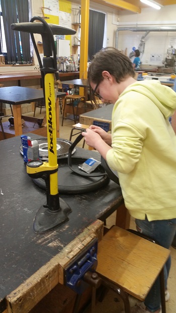 Erin fixing the wheel 350
